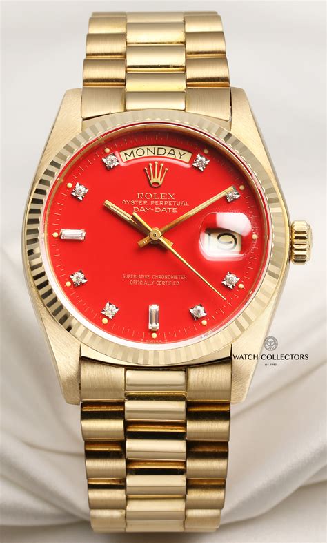 red dial.rolex|Rolex watch with red face.